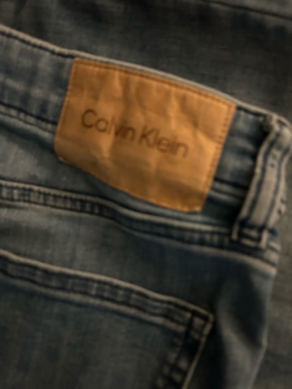Calvin Klein Slim Light Blue Denim Jeans with Tan Leather Patch 34/30